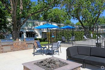 BBQ area by firepit and seating 